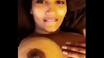 NRI playes with her pierced nipple